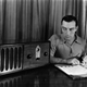 circa 1925: Buster Keaton (1895 - 1966), the American film comedian who started his career in Hollywood in 1917, timing his comedy scripts against radio music.